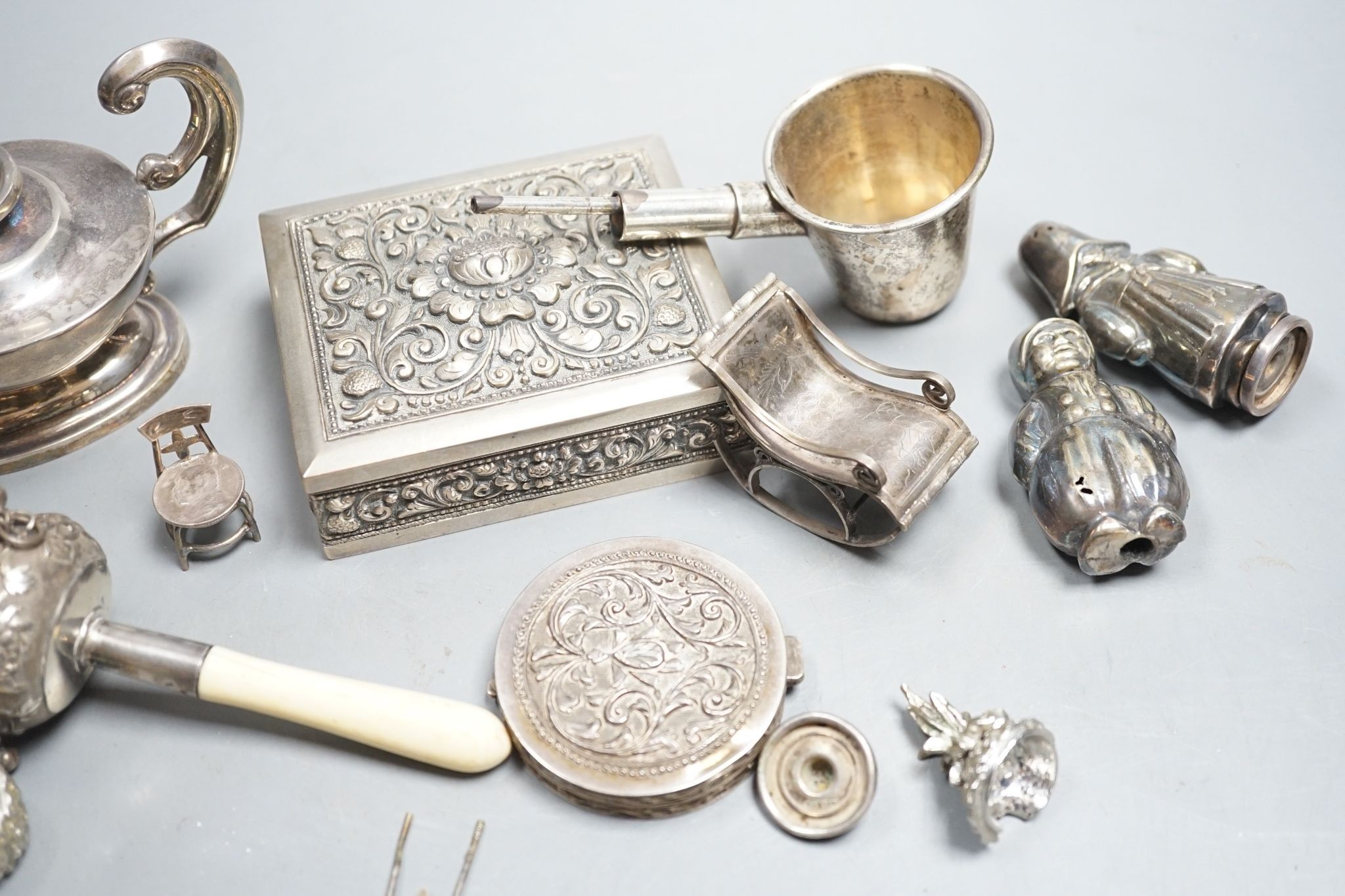 A group of small continental white metal items including a 800 compact, coin mounted miniature furniture, cigarette box, plated lamp lighter, etc.